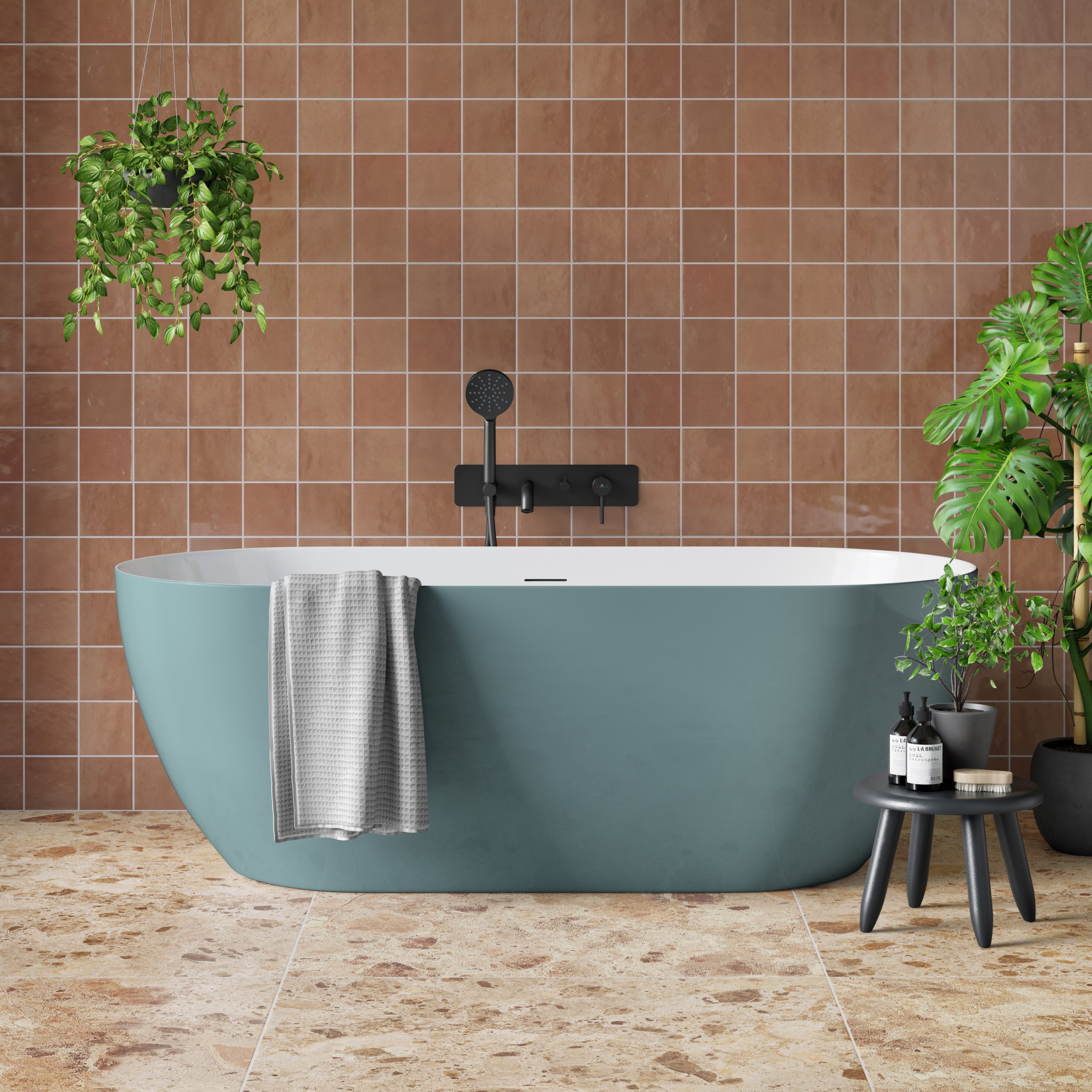 bathroom with green plants and a blue bathtub