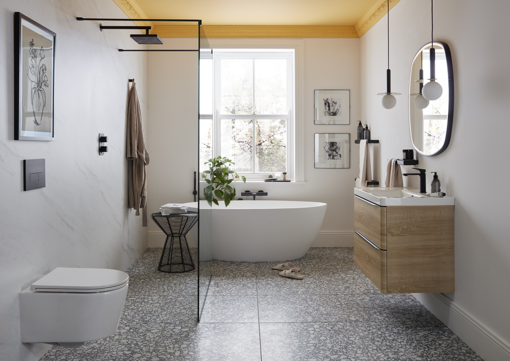 bathroom with walk in shower and stand-alone white tub