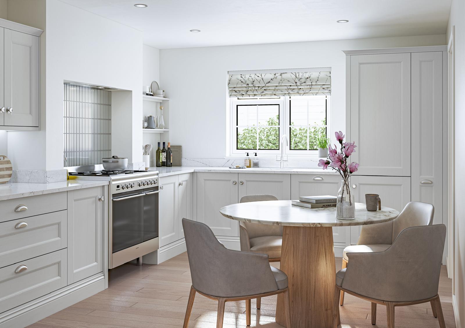 White kitchen with a round dining table