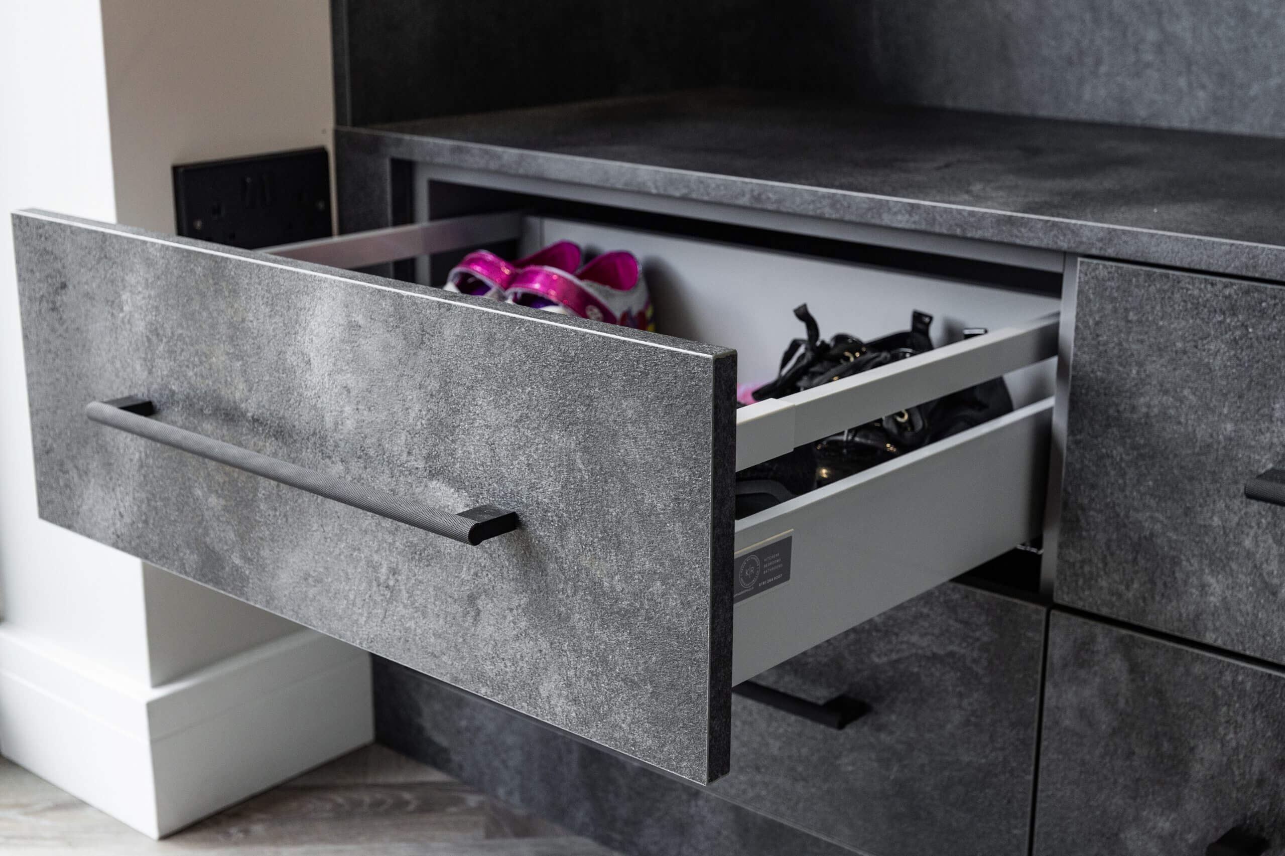 KevinRichardson-71 cabinet drawers with a drawer open