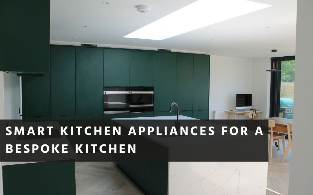 built-in ovens flush with the tall cabinetry, a completely clear island worktop with what looks like a Quooker-style tap, no overhead extraction visible, and a seamless run of handleless doors where you cannot tell which panels hide appliances and which are storage.